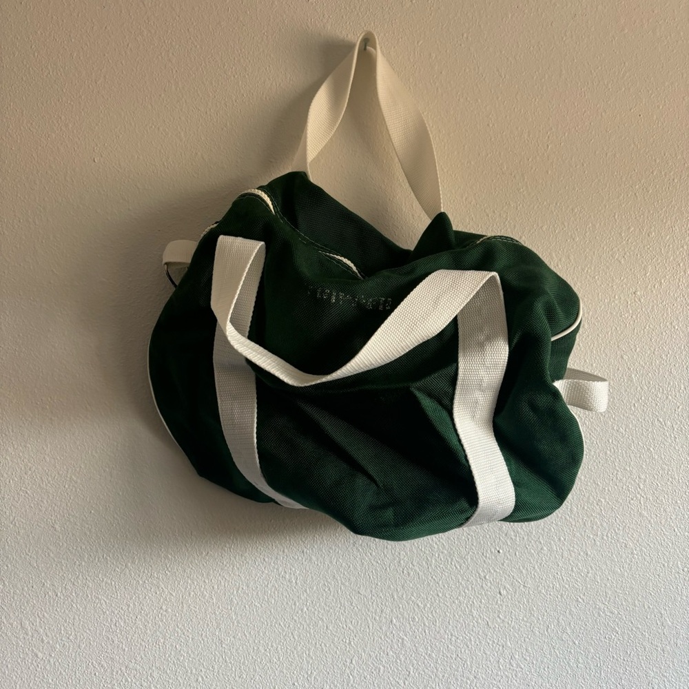 Small vintage green duffel bag